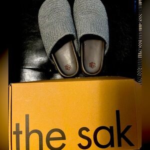 The sak clogs sparkly silver.